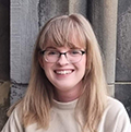 girl with long blond hair and glasses